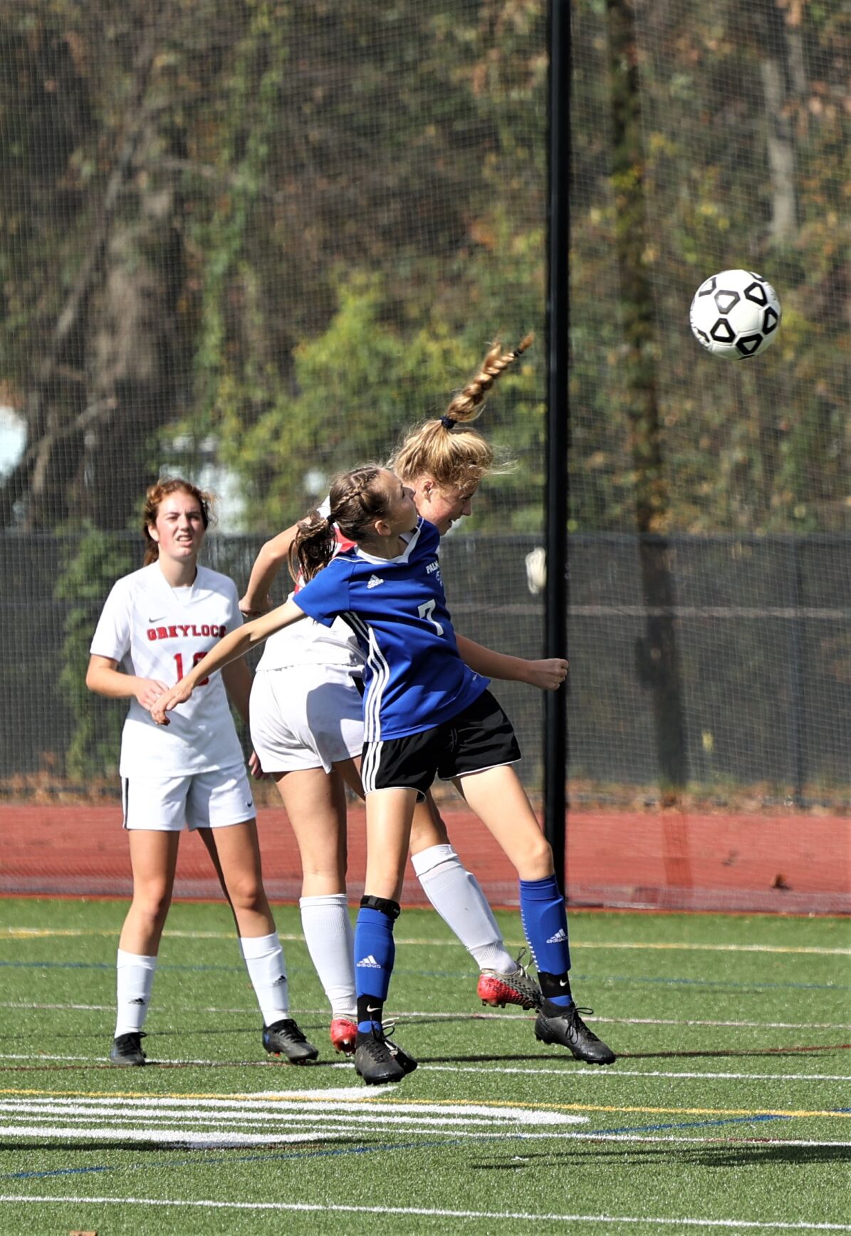mackenzie sheehy heads a ball clear